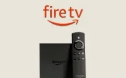 Amazon Fire TV Stick with its remote, ready for British IPTV TV